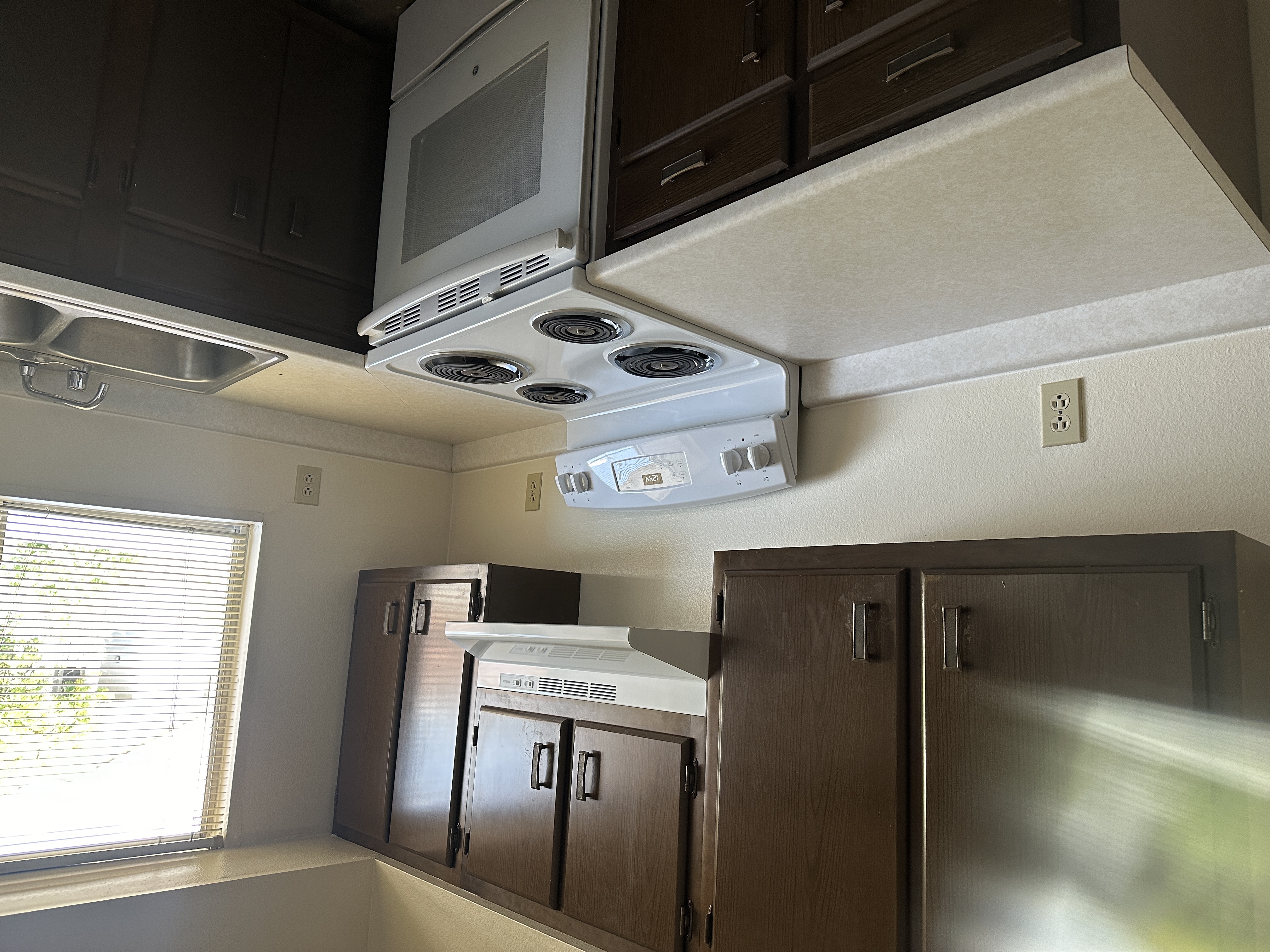 Kitchen angle showing stove and countertops